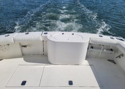 the back of a boat with a wake behind it